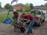 HPSI member, Mark Zippel, helps Lauren unload the shrubs.